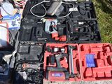 a lot of tools that are laying out on the ground
