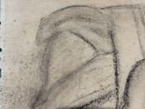 charcoal drawing of a woman sitting on a couch with her head resting on a pillow