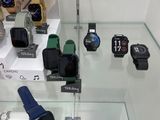 many different types of watches on display in a glass case