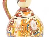an image of a vase with a bird on it