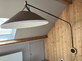 a lamp that is hanging from the ceiling in a room