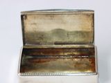 a silver box that is sitting on a table