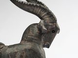 a statue of a goat with horns on it ' s head
