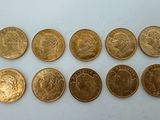 six different types of coins are shown on a white surface