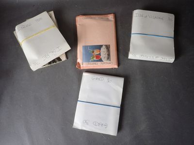 several small books are lined up on a black surface