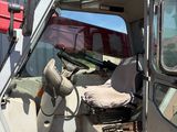 an image of a truck with the door open and the driver ' s seat up