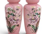pair of pink vases with birds and flowers painted on them