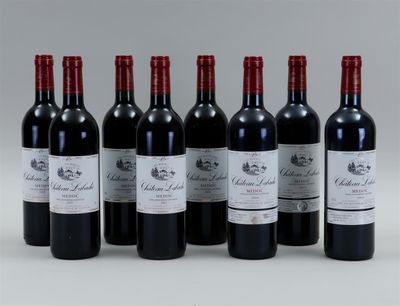 six bottles of red wine lined up in a row