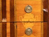 a wooden dresser with two drawers and a vase on top