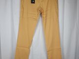 a pair of yellow pants hanging on a white curtain