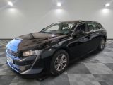 a picture of a black car parked in a showroom