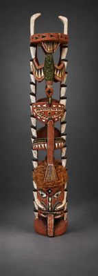 an image of a wooden totema with horns on it