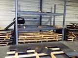 a man that is standing on a skateboard in a warehouse
