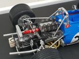 a model of a racing car on a black surface