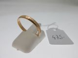 a gold ring with a price tag attached to it