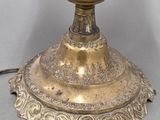 a vase that is sitting on a stand on a table