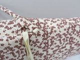 a white and red bag with a zipper on it