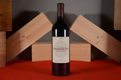 a bottle of wine that is sitting on a table