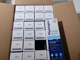 a cardboard box filled with a lot of white boxes