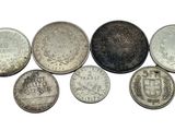six different types of coins are shown in a row on a white background