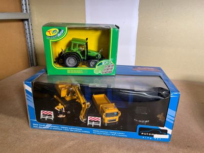 two toy vehicles in the box on the table