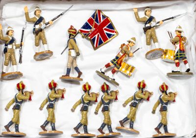 many figurines of soldiers and drummers in a display case