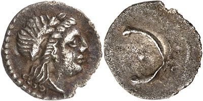 a silver coin with an image of a woman on it
