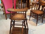 many chairs and a table in a room with a pink chair