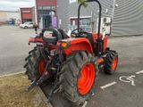a tractor that is parked in the parking lot