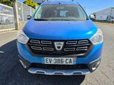 the front view of a blue dacia parked in a parking lot
