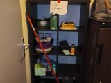 a mop that is sitting on the floor in the corner of a room