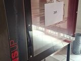 a machine that is sitting on the floor in a room