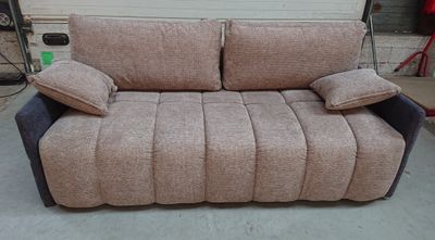 a couch that is sitting in a garage