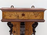 a wooden shelf that has a clock on it