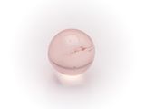 an image of a pink glass ball on a white surface