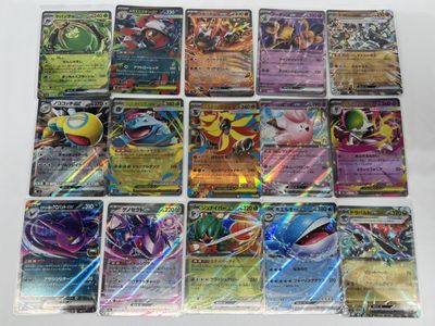 a bunch of pokemon cards sitting on top of a table
