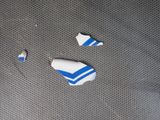 two pieces of blue and white paint on a piece of cloth