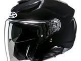 un casque noir avec une visière transparente sur fond blanc