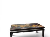 a black and gold coffee table on a white background