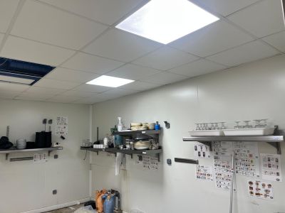 an image of a kitchen with a lot of clutter on the walls