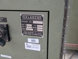 a close up of a green machine with a label on it
