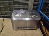 a small ice cream maker sitting on the floor