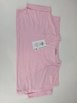 a pink t shirt with a tag on the back of it
