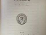 a close up of an open book with a seal on it