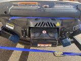 an image of a car with a blue tow rope attached to it