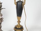 two lamps that are sitting next to each other on a table