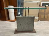 a glass table with a glass shelf on top of it