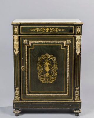 a black and gold painted cabinet with a marble top