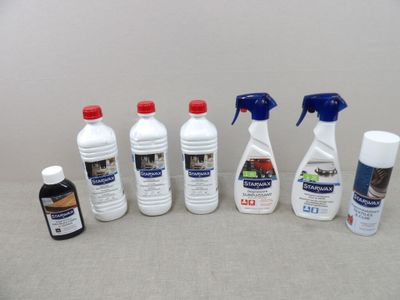 several bottles of cleaning products sitting on a table next to each other