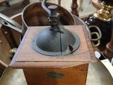 a small coffee grinder sitting on top of a table